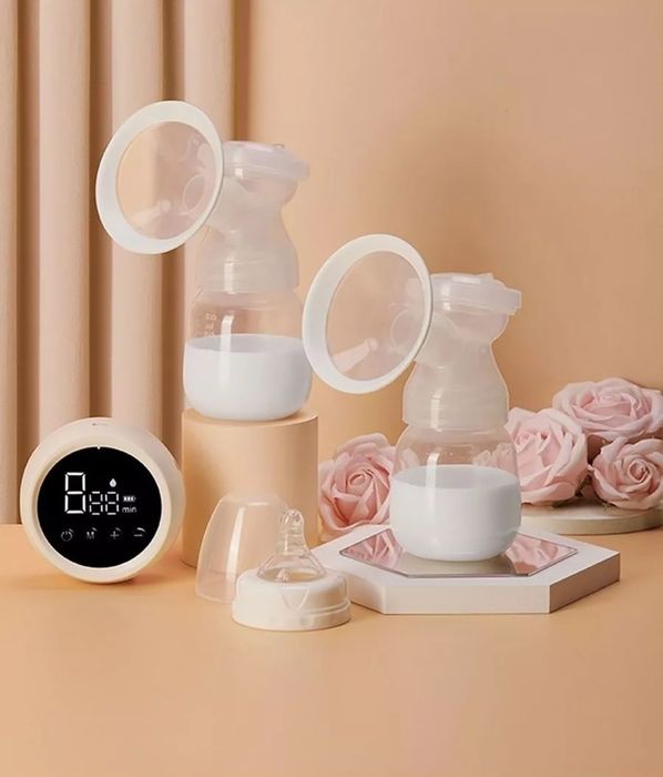 Электрический молокоотсос + бутылочка для кормления.