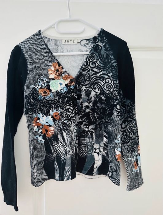 Set cardigan și bluză cu mânecă scurtă din 50% lână merinoz.