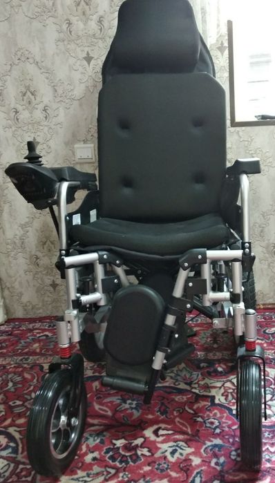 Инвалидная коляска.