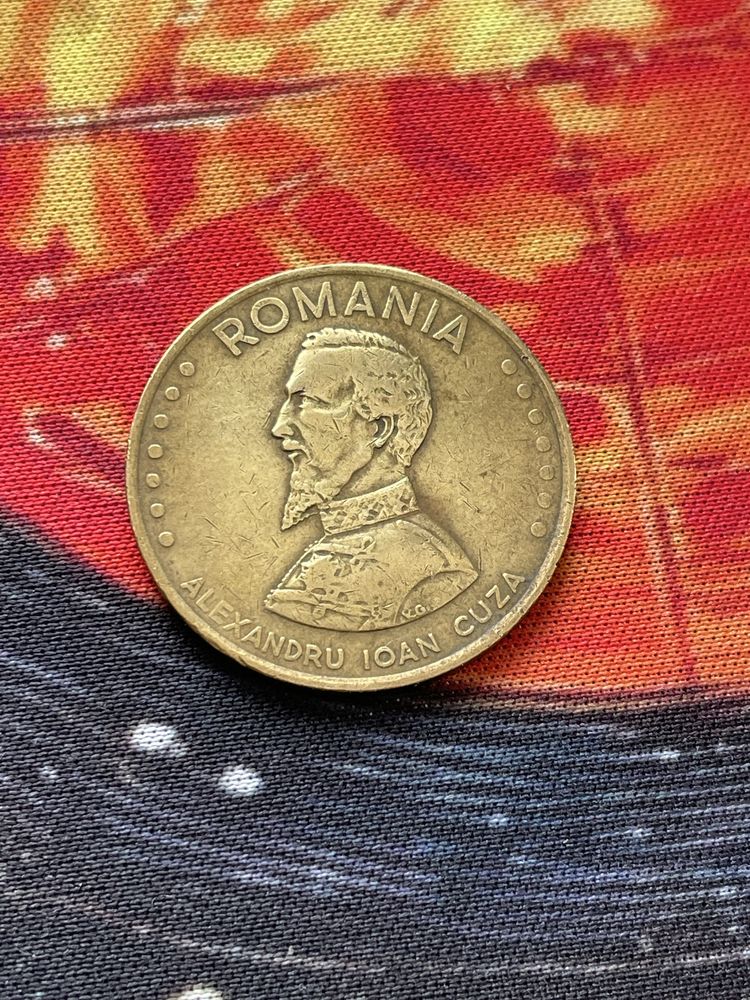 Monede de 1 leu si una de 50 lei