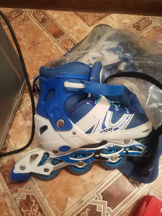 Роликовые коньки