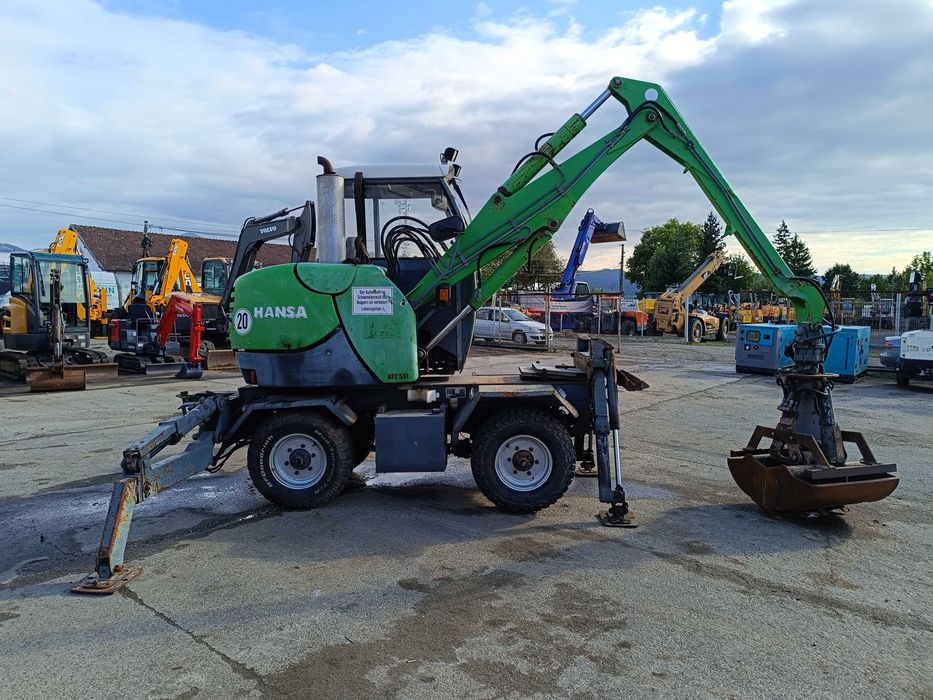 Excavator pe roți HANSA APZ 531 – 2003 – graifer hidraulic rotativ