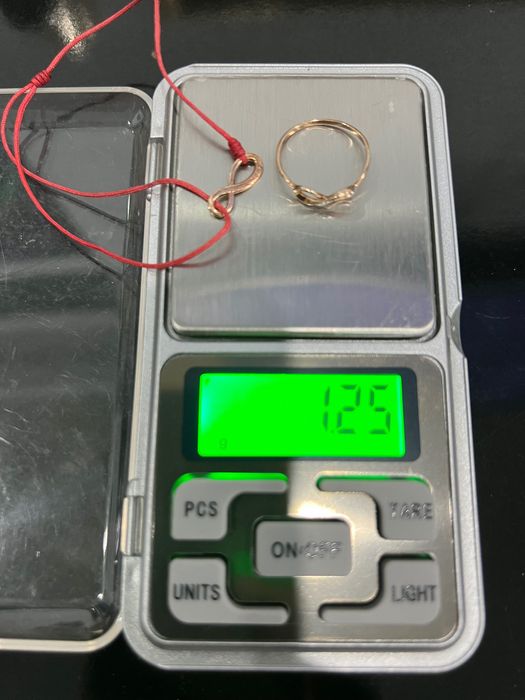 Продам оригинальный золотой комплект бесконечность