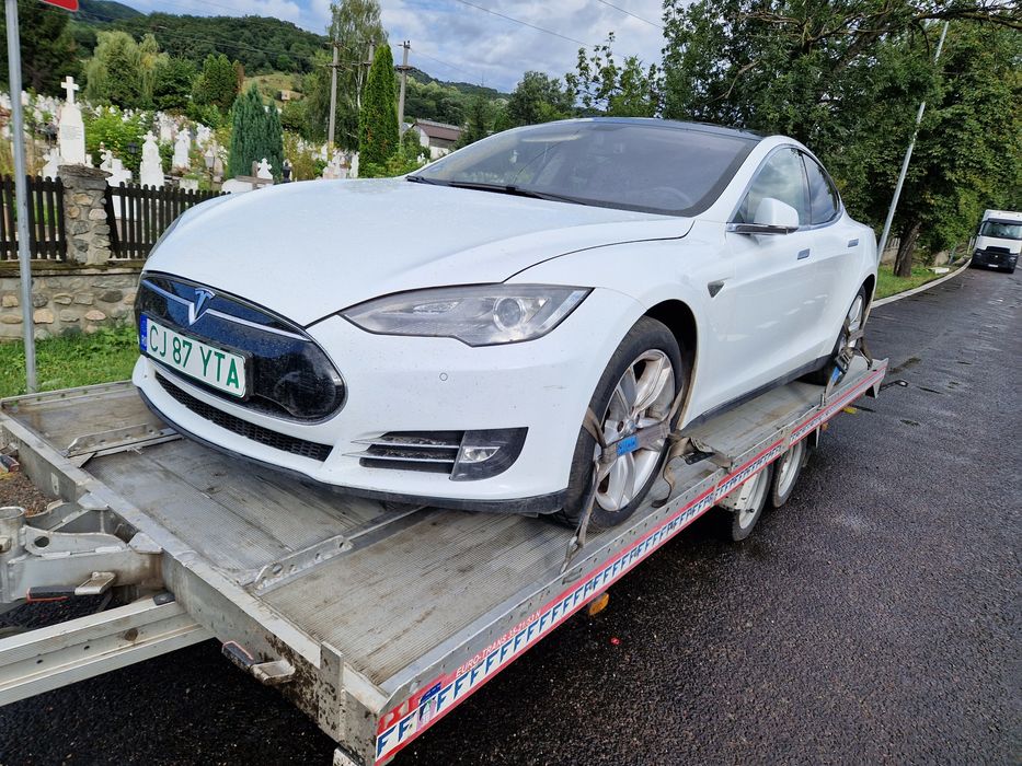 Tractari auto transport Romania Spania pe platforma dube utilaje