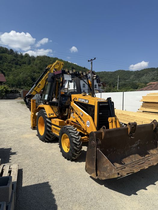 Buldoexcavator Caterpillar 428B 4x4 cu blocanti si 3 cupe