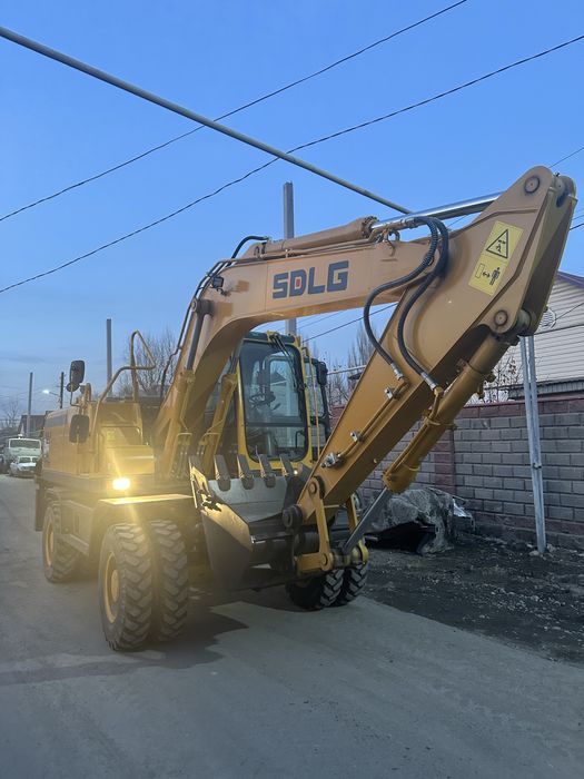 Экскаватор колесный аренда услуги погрузчик каток
