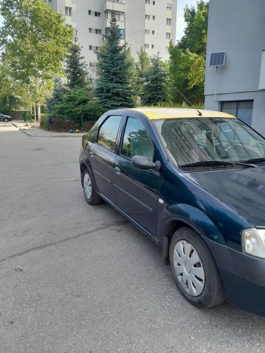 Vind Dacia Logan 1.4 benzina stare buna.