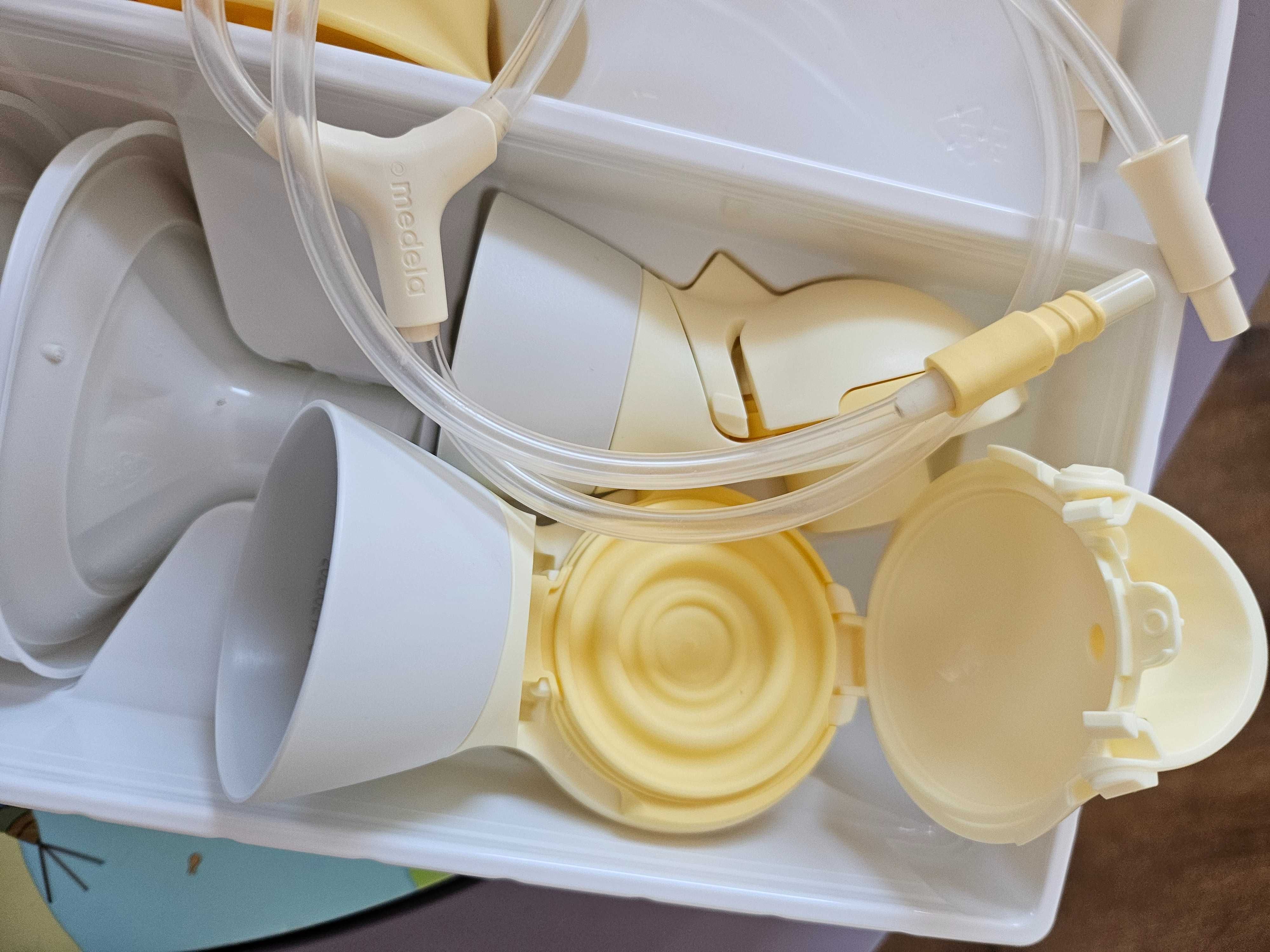 medela  със СУТИЕН двуфазна двойна електрическа помпа maxi