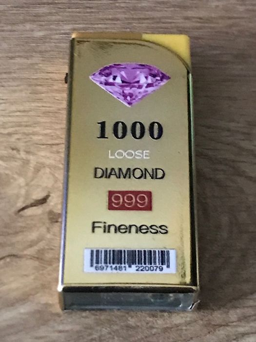 Златиста запалка  против вятър