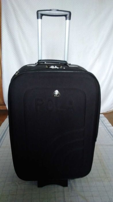 Среден-голям куфар с колелца и телеск.дръжка