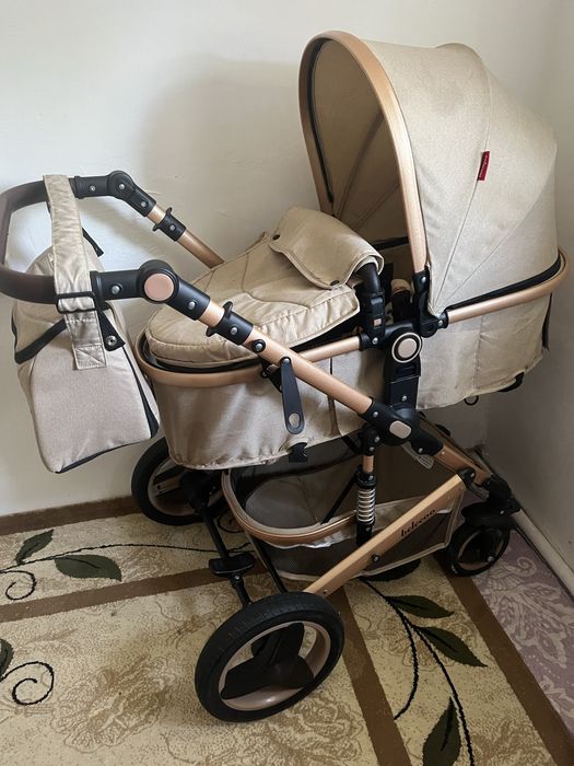 Продам коляску , ходунок , коврик