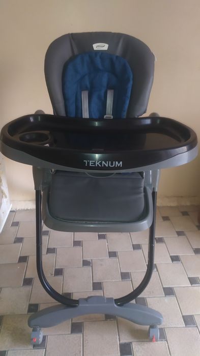 Фирменный стульчик для кормления TEKNUM