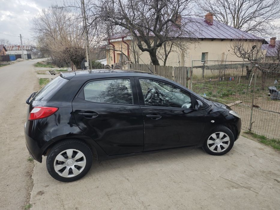 Mazda 2  benzină sau schimb