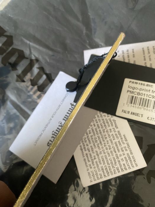 Pantalonii scurtii palm angels