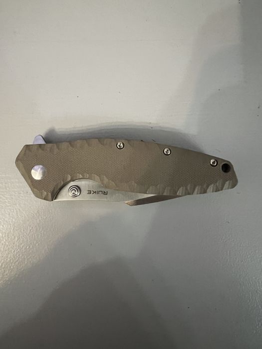 Briceag Ruike Otel inoxidabil 12C27, maner din G10