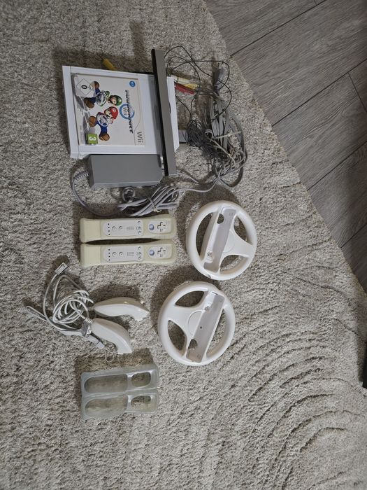 Consola Nintendo Wii + 2 jocuri + telecomanda motion