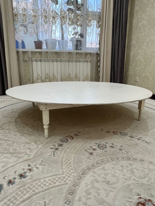 Дөңгелек жер стол.