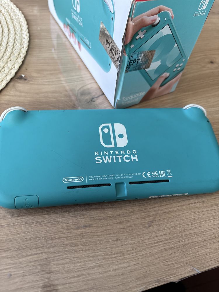 Nintendo switch lite + 2 игри