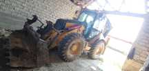 Caterpillar 444 E buldoexcavator buldo