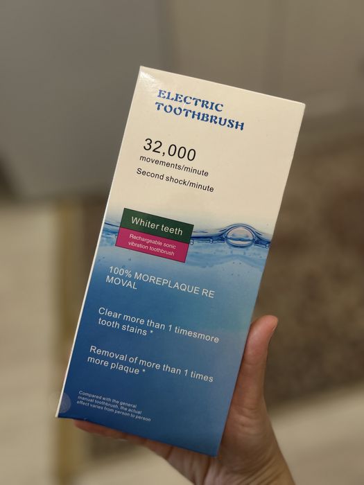 Электрическая зубная щетка