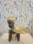 Sculptura africana cu taler