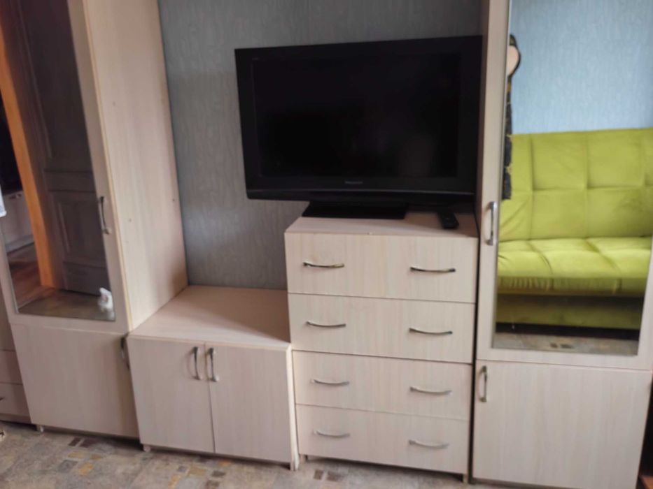 Стенка-горка. Один шкаф с полками. Второй для одежды.