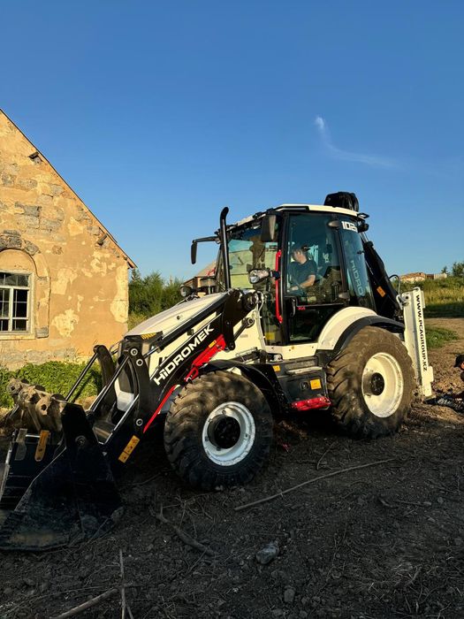 Услуги Экскаватор погрузчик.