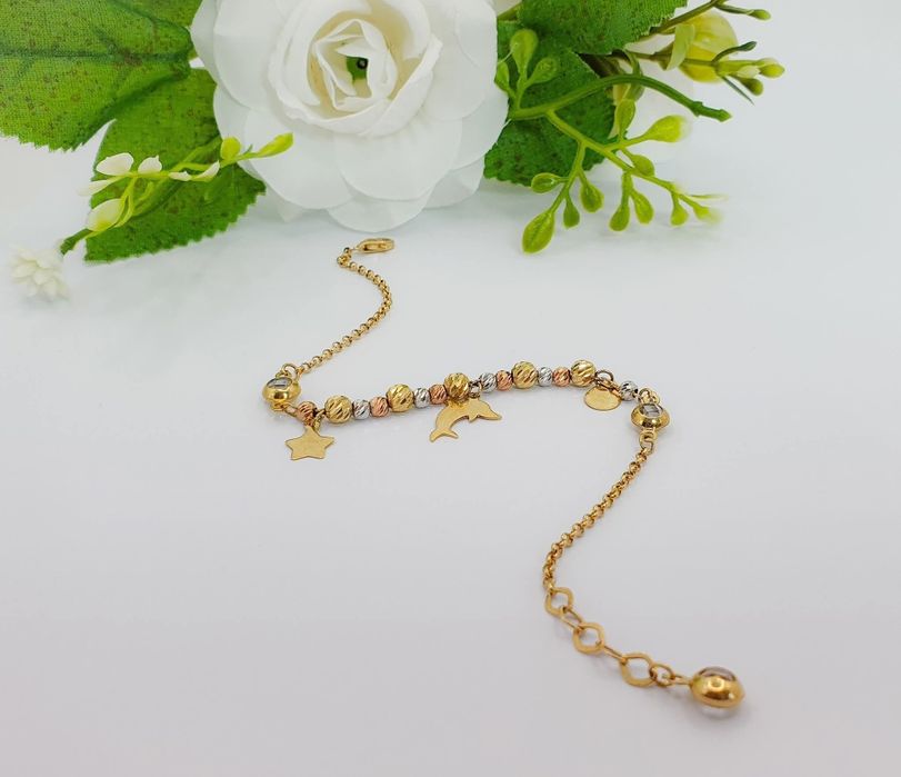 Brățară din aur 14K cu bile bicolore și accesorii delfin etc ...