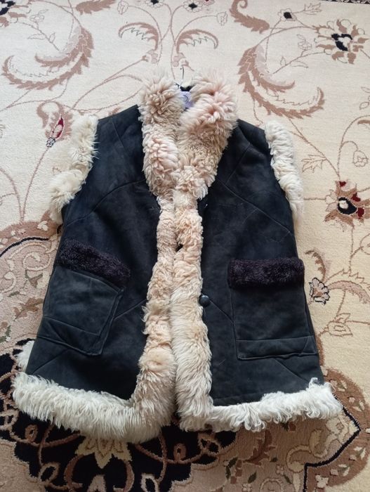 Теплая безрукавка