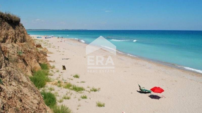 Regulated plot with building permit for complex of houses near the sea