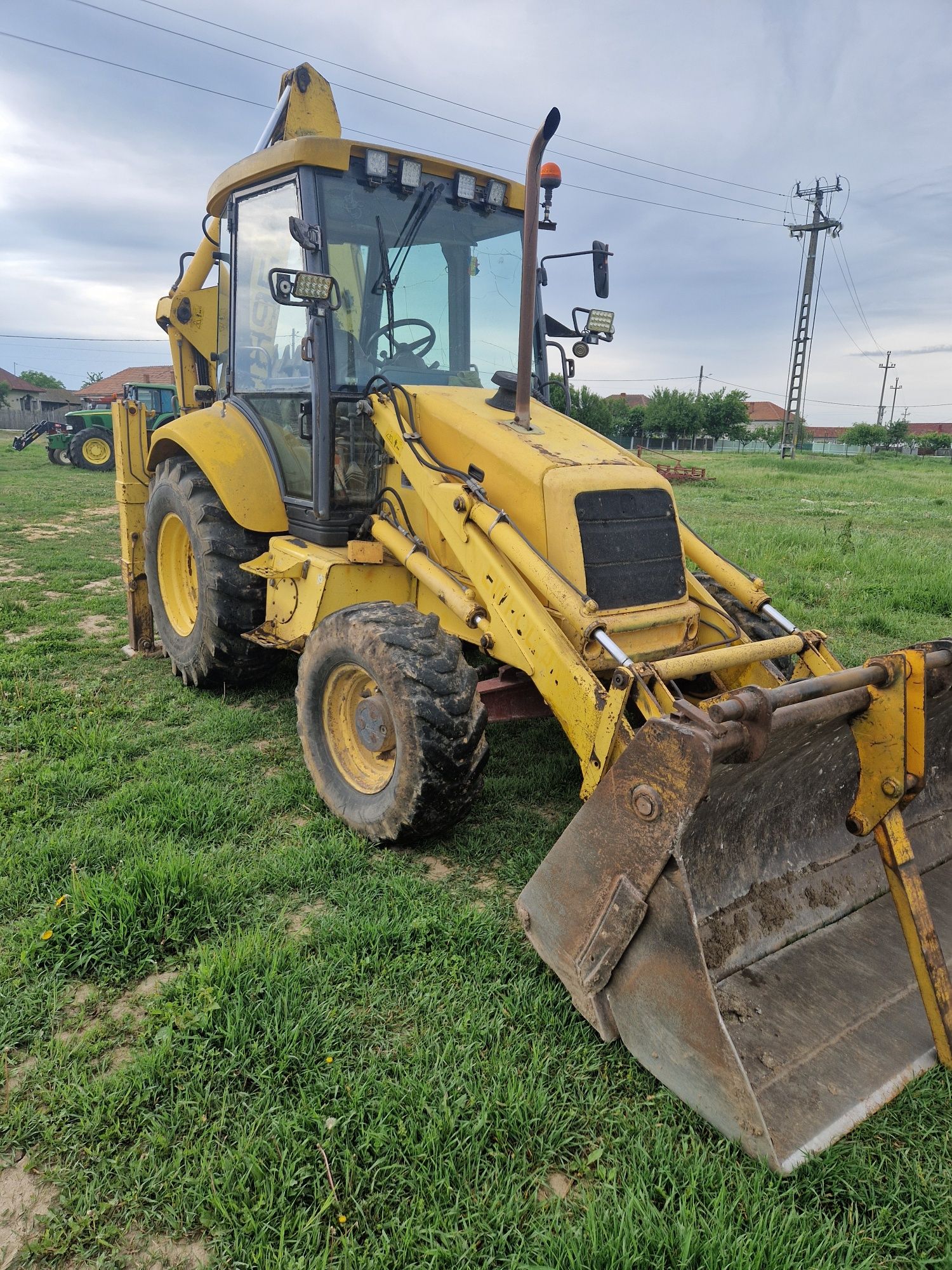 Buldoexcavator New Holland NH95