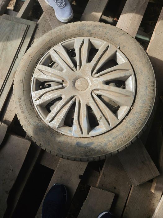 Vand 4 genti tabla cu capace si anvelope peugeout