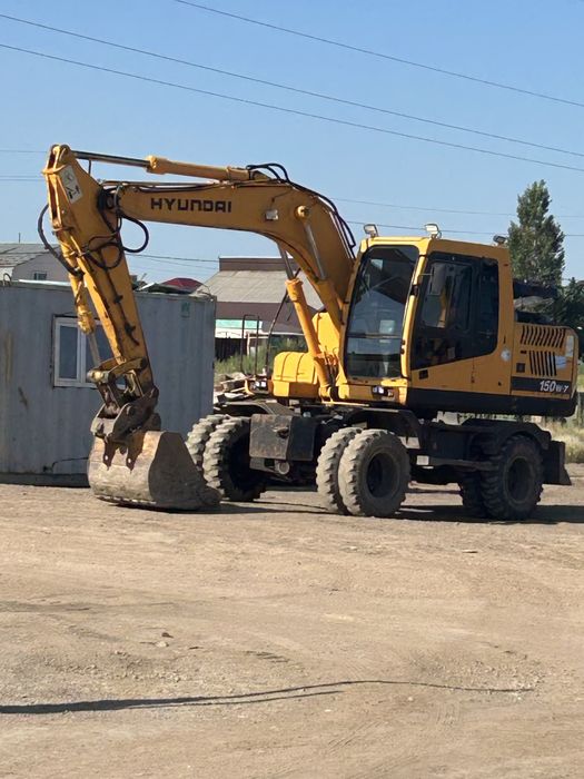 Экскаватор колесный с гилромолотом 1тонна