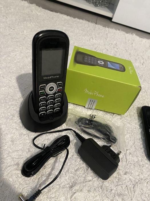 Telefon fix cu stand pentru incarcare si casti .noi noute