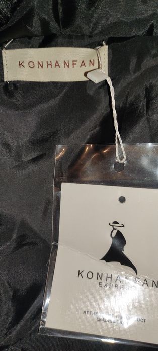 Дамски пухен елек с качулка