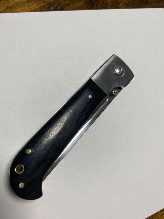 Сгъваем нож с текстилен калъф.