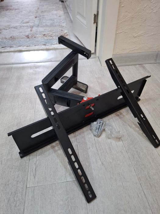 Продам универсальный кронштейн под ТВ новый.