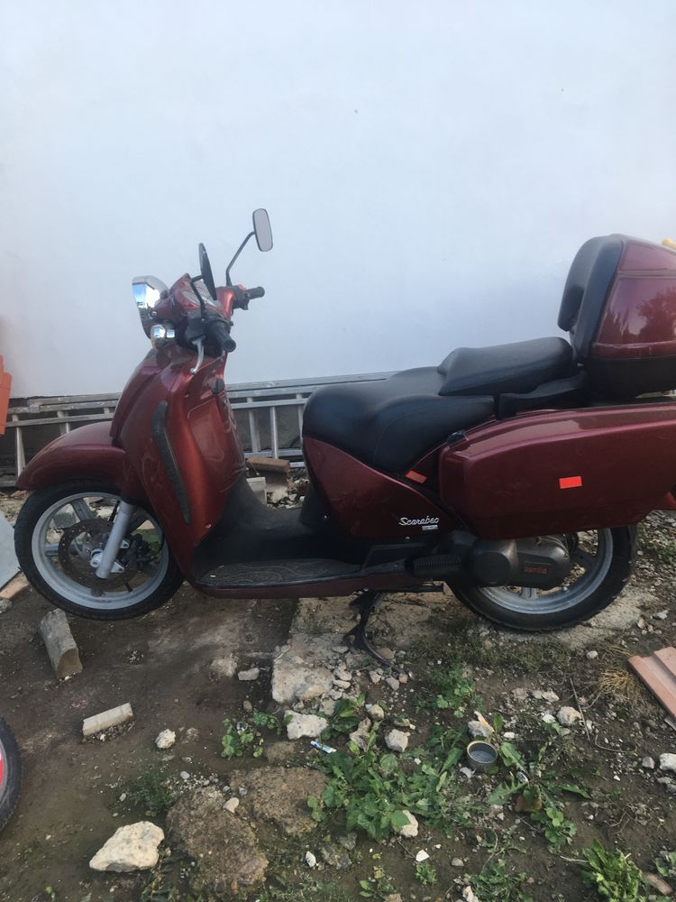 Vand motor aprilia scarabeo 125 cm și la schimb