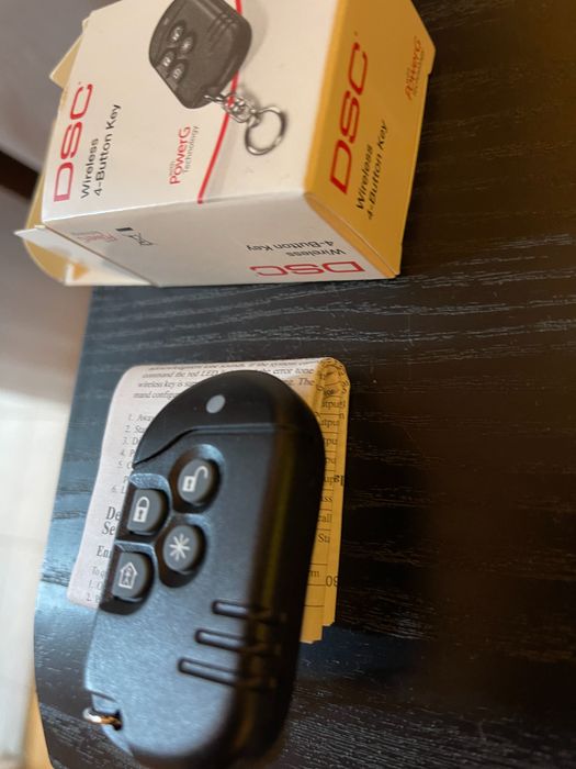 Telecomanda sistem alarma cu 4 butoane DSC seria Neo.