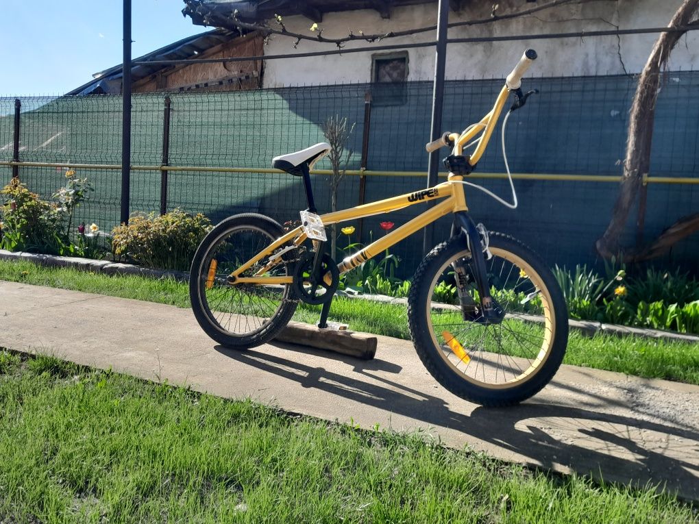 Bicicletă BMX culoare galben lucios