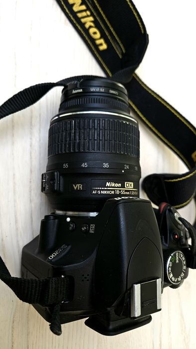 Nikon D3200l SLR camera with an 18-55mm VR lens.