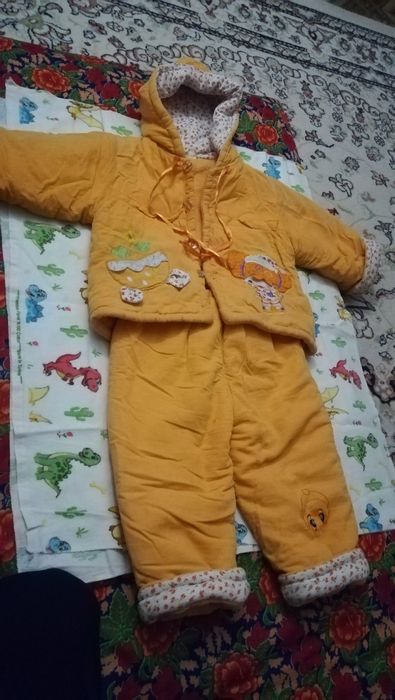 Продам зимний комбинезон 2000