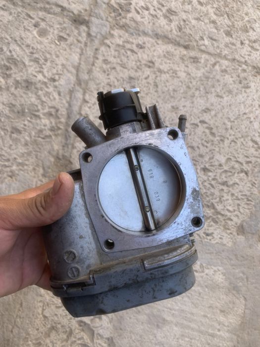 Дросленный заслонка