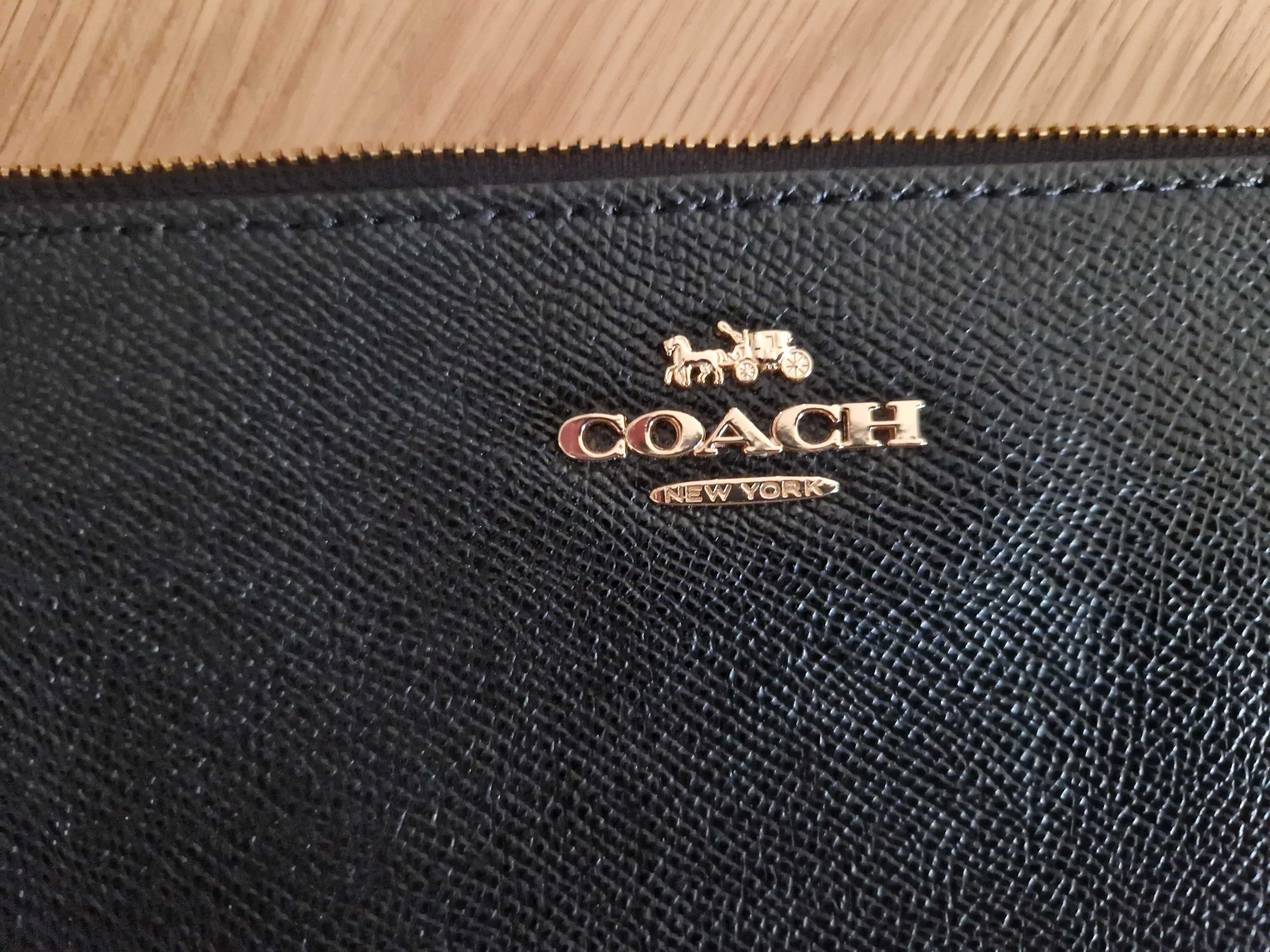 Portofel de mana din piele marca Coach