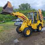 Buldoexcavator Komatsu WB70ă im stare buna