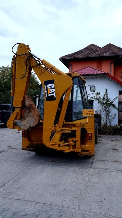 Buldoexcavator Caterpillar