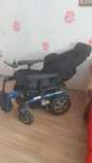 Scaun cu rotile, acționat electric
