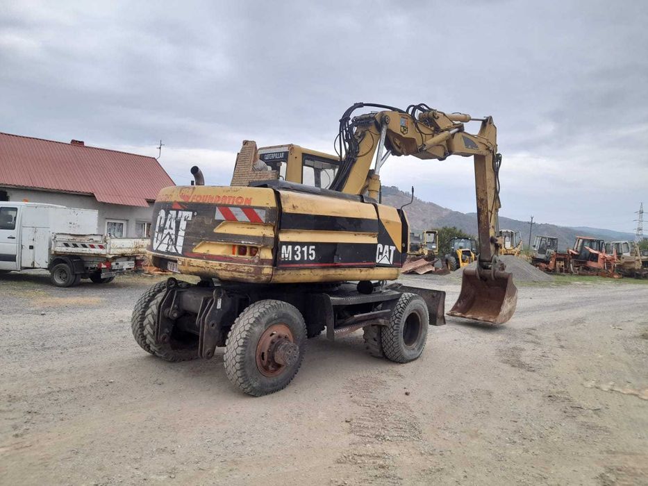 Piese excavator pe roti Caterpillar M 315