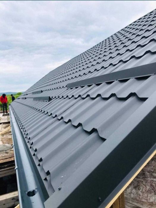 Jgheaburi și burlane montate pentru protecția fațadei