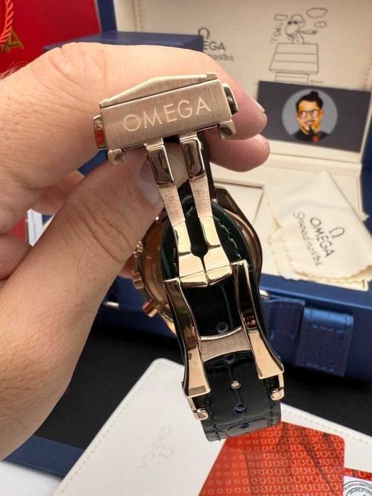 omega speedmaster златно/зелено